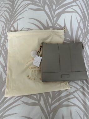 Gray Pom Pom London Leather Crossbody Bag with straps and wallet